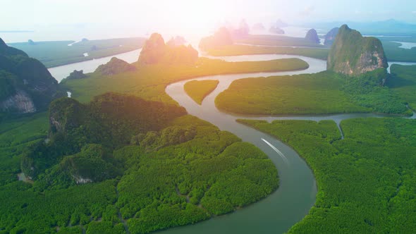 Aerial view from a drone over many islands at Phang Nga Bay during sunset time