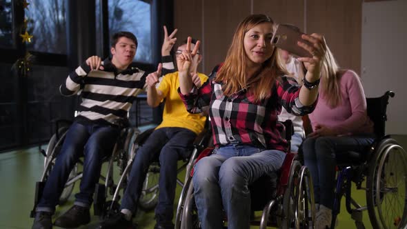 Happy Disabled People in Wheelchairs Making Selfie