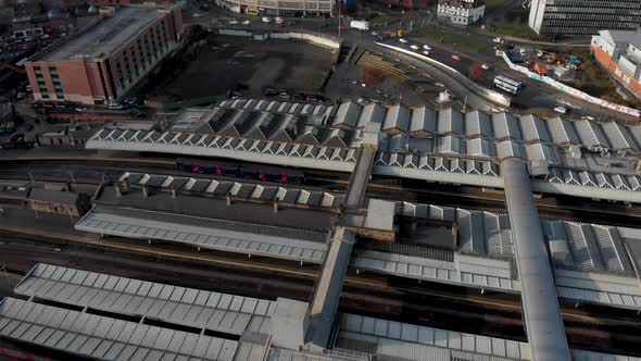 Drone shot above the city of Sheffield, panning over the Train Station, Sheffield Hallam, Park Hill