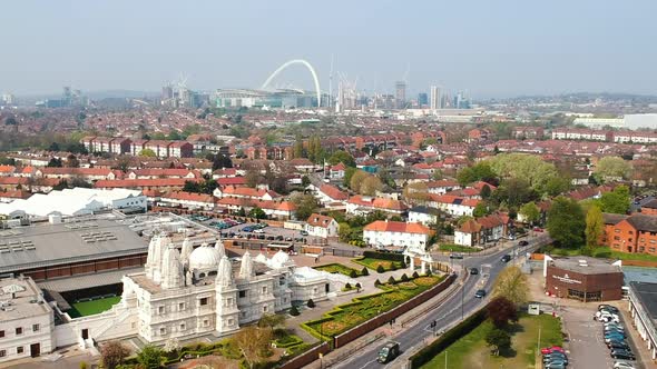 Ariel view of Brent in London with Wembley Stadium skyline and the Neasden Hindu Temple, BAPS Shri S