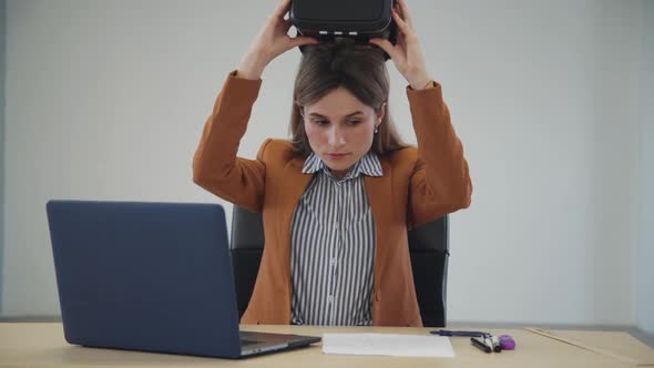 Female Wearing Virtual Reality Glasses and Working in Cyber Spac