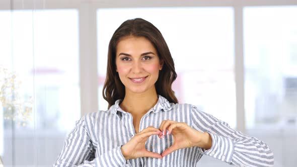 Heart Sign by Beautiful Hispanic Woman, Hands Gesture