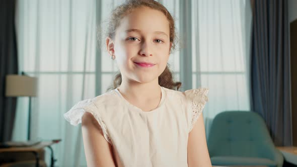 Portrait Funny Little Girl Smiling Child Looking at Camera are Sitting on the Couch at Home Cute Kid