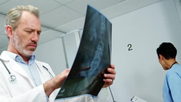 Doctor examining x-ray