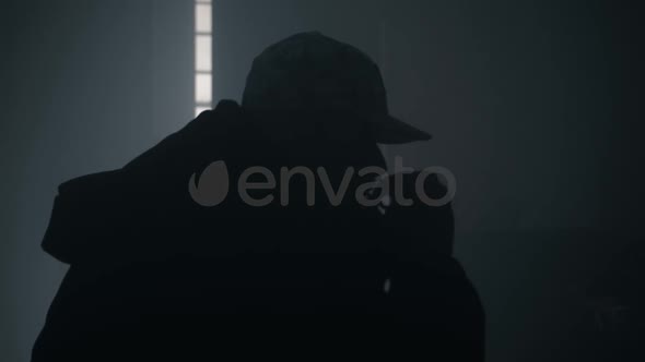 Silhouette Of Man Smoking Cigarette Or Drugs