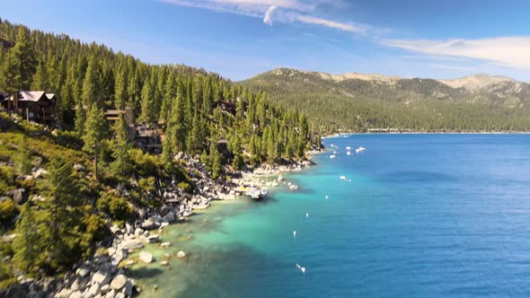 Drone flying along Private shoreline along North Lake Tahoe.