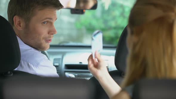 Young Woman Giving Money to Taxi Driver, Paying for Transport Service, Carpool