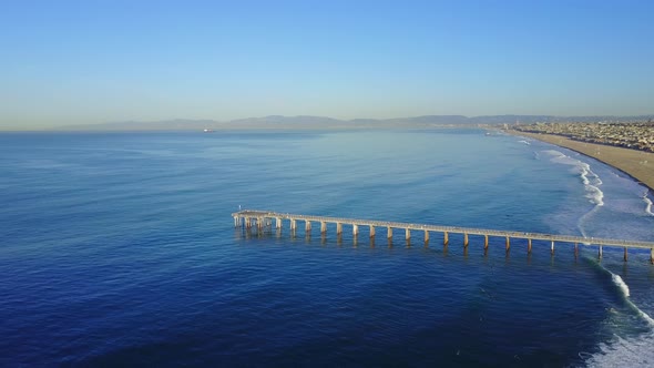 Aerial drone uav view of a pier over the beach and ocean