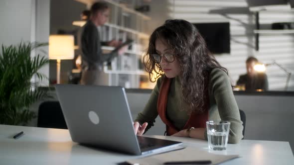 Young Business Woman Professional Entrepreneur Using Laptop Computer Notebook At Workplace Typing