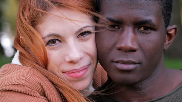 Portrait Of young attractive Happy Mixed Race Couple in the park