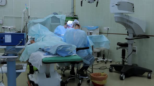 Surgeons perform an operation to repair the nerve of the arm
