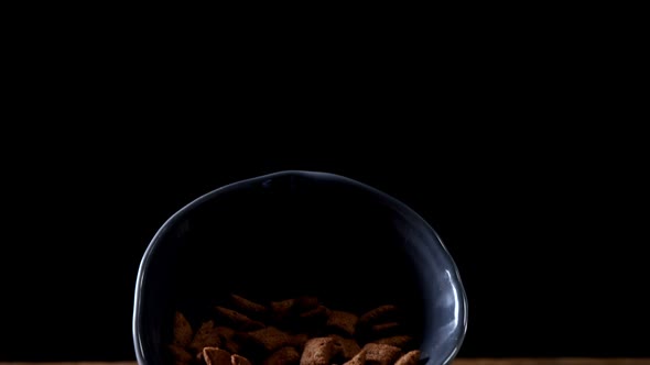 Chocolate toast crunch spilling out of bowl