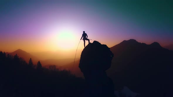 Climber Launches Rope From Top Of The Summit