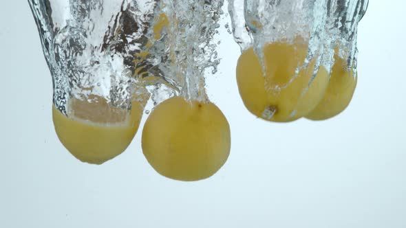 Lemons splashing into water in slow motion; shot on Phantom Flex 4K at 1000 fps