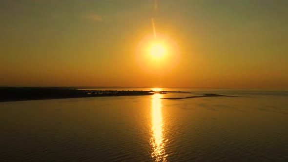 Aerial view over the delta of the Vistula to the Baltic Sea at sunse. Mikoszewo, Jantar