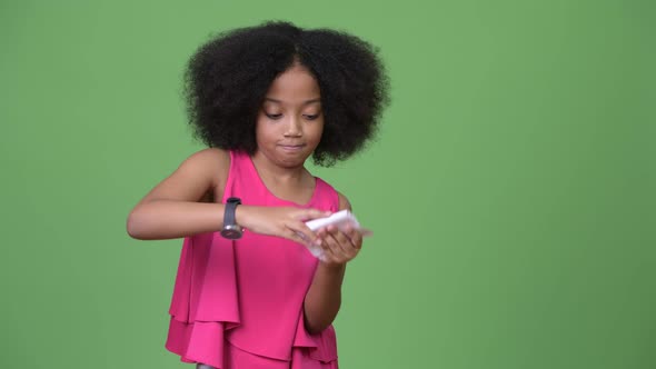 Young Cute African Girl with Afro Hair Crunching and Throwing Paperwork