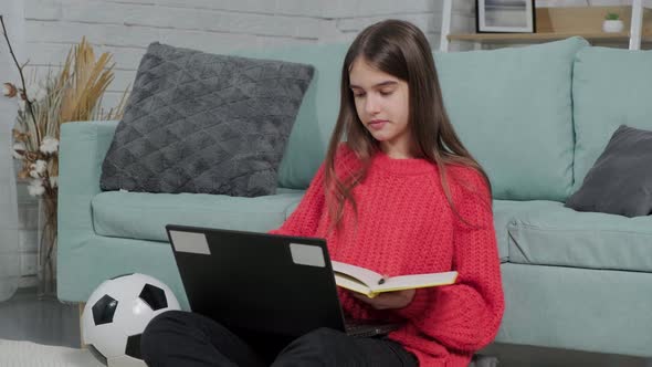 Beautiful Girl Making Notes of Online Lecture Lesson Sitting on the Floor Carpet