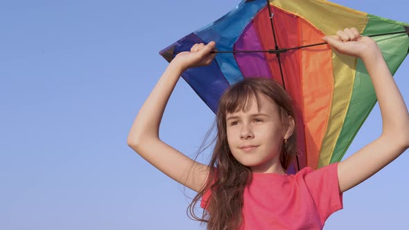 Girl play a kite. 