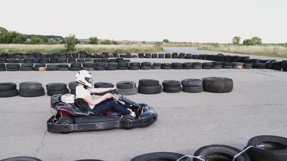 Male Racer in Protective Helmet Racing on the Go-kart Track Outdoors