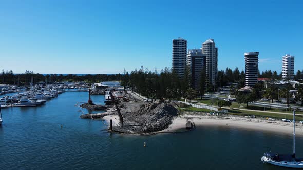 Revealing drone view of a government infrastructure project in a boating marina and harbor next to a