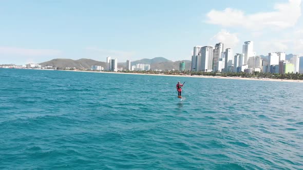 Extreme Water Sport and Summer Vacations Concept. Professional Kite Surfer on the Sea Wave, Athlete