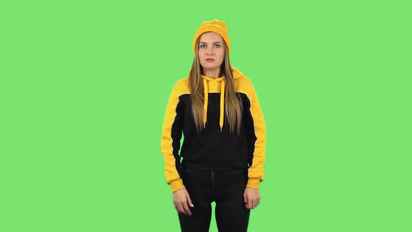 Modern Girl in Yellow Hat Is Scolding, Shaking Her Index Finger and Threatening. Green Screen