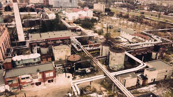 Aerial view of a drone flying over an industrial plant. Plant pipes