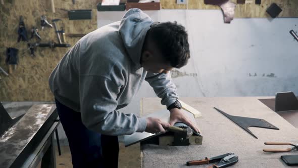 Professional Tinsmith Working with Metal Workshop