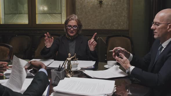 Diverse Team of Lawyers Cooperating at Office Meeting