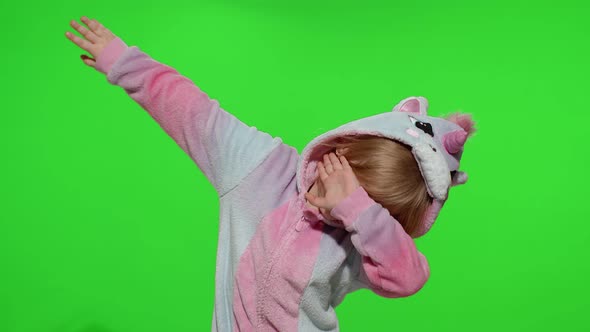 Little Blonde Child Girl Dancing Celebrating Performing Dab Dance in Unicorn Pajamas Costume