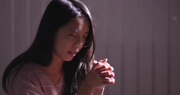 Woman Pray in The Dark
