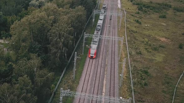 Aerial View of Subway Train on Tracks Moving in Moscow Park Zone at Day