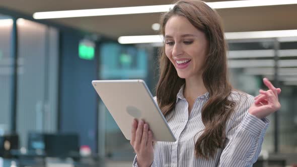 Portrait of Video Call on Tablet by Young Businesswoman
