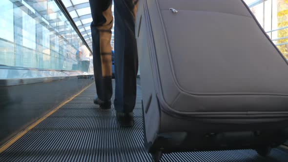 Feet of Successful Businessman Walking in Hall of Terminal with His Luggage. Legs of Wealthy