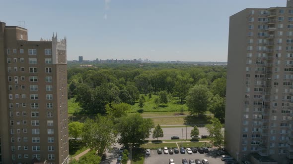 Pull back over Forest Park in St. Louis, Missouri and past and over apartment buildings in Clayton o