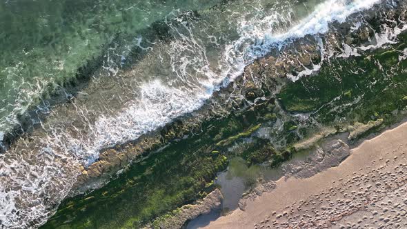 Texture of the rocky beach aerial view 4 K Turkey Alanya
