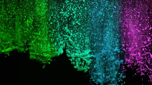 Super Slowmotion Shot of Color Powder Waterfall Isolated on Black Background