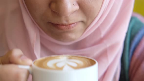 Close Up of Muslim Women Drinking Late Coffee