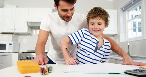 Father helping son with homework