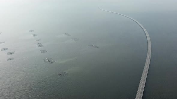 Aerial tilt up the Sultan Abdul Halim Muadzam Shah Bridge