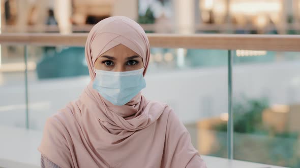 Young Woman in Medical Protective Mask Shows with Palm Stop Sign Gesture Forbidding to Approach Due