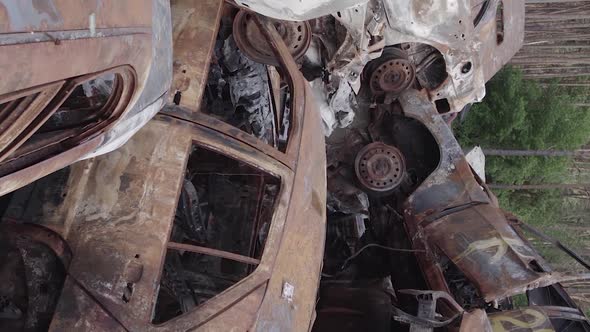 Vertical Video of the Consequences of the War in Ukraine  Destroyed Cars