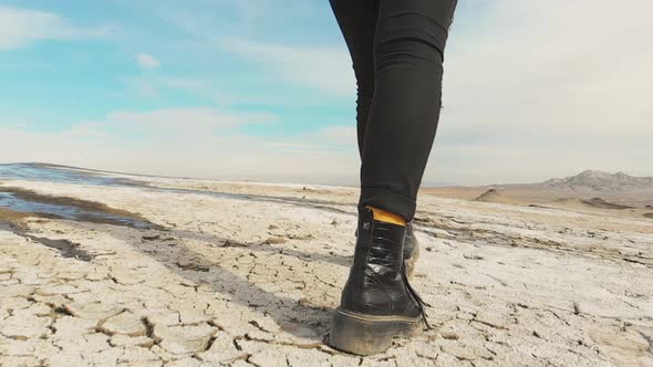 Low Angle Close Up Boots Tracking On Volcanic Terrain