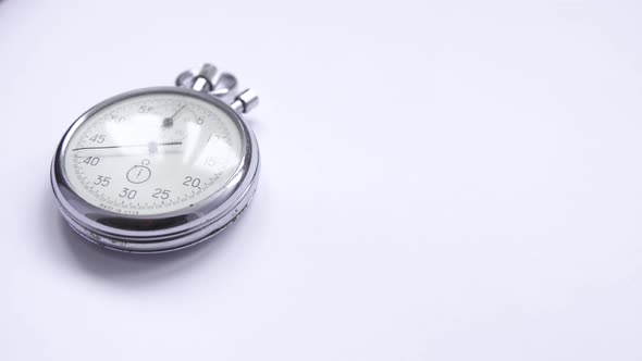 Clock in the Accelerated Shooting With a White Background