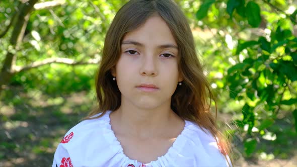 The Ukrainian Flag is Drawn on the Child Hands