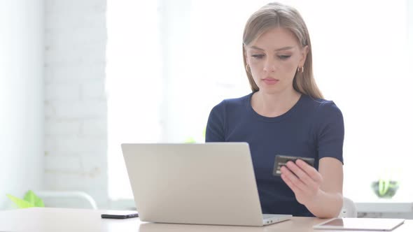 Woman Making Successful Online Payment on Laptop