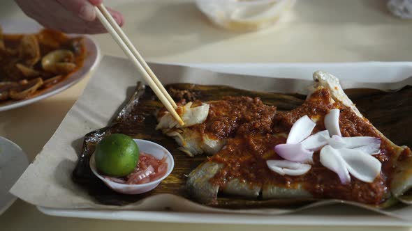 Singaporean, Malaysian food grilled stingray sambal sauce serve on banana leave