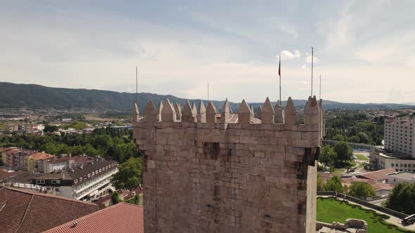 Aerial parallax of medieval Tower of Chaves Castle, cityscape as Background