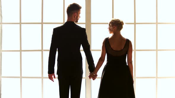 Ballet Couple Holding Hands Back View