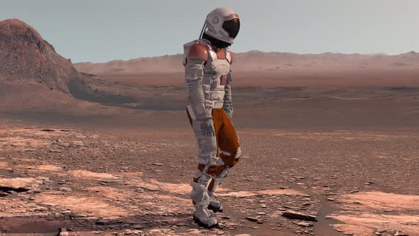 Astronaut Wearing Space Suit Walking On The Surface Of Mars alt